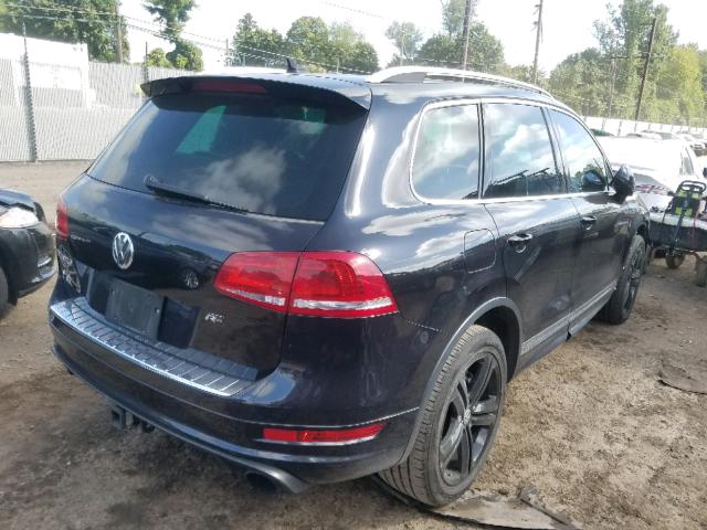 Купить бу VOLKSWAGEN TOUAREG 3.6 2014 года в США