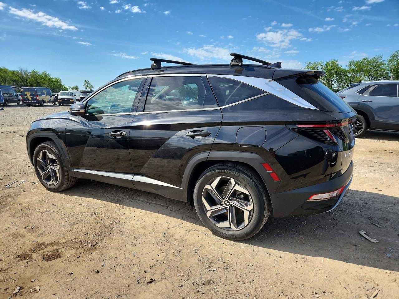 Купить б/у HYUNDAI TUCSON HYBRID 2022 года из США