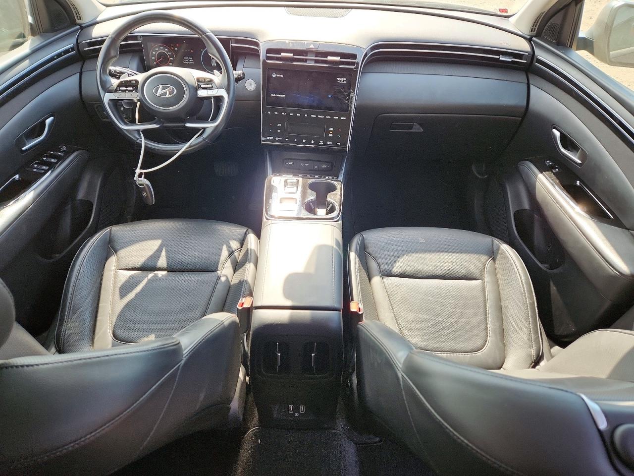 Купить б/у HYUNDAI TUCSON HYBRID 2022 года из США